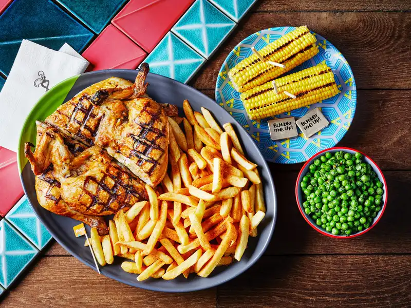 Nando's chicken with peri-peri chips, corn on the cob and peas - the classic Results Day celebration meal